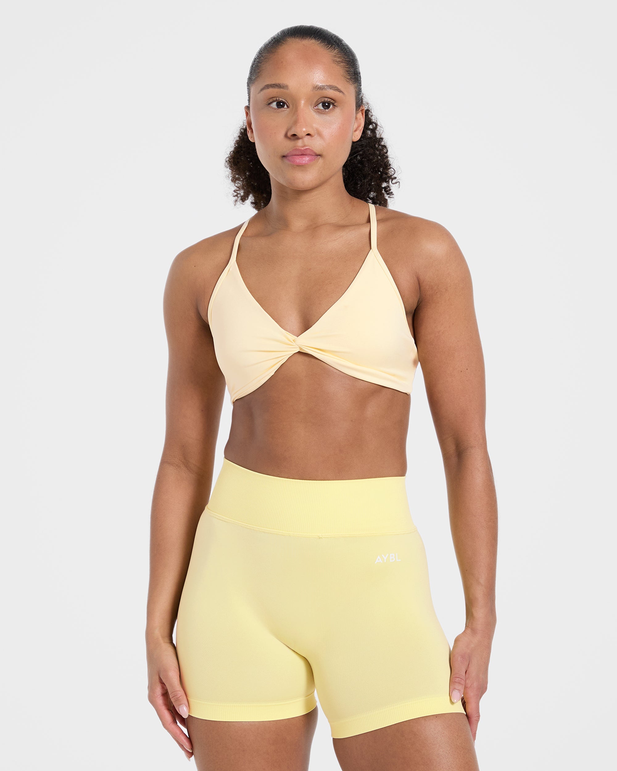 Essential Twist Crossback Sports Bra - Gelb