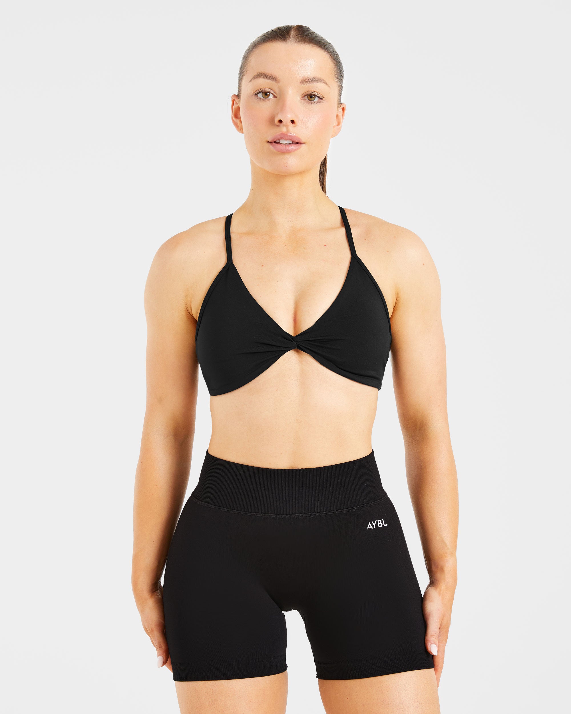 Essential Twist Crossback Sports Bra - Schwarz