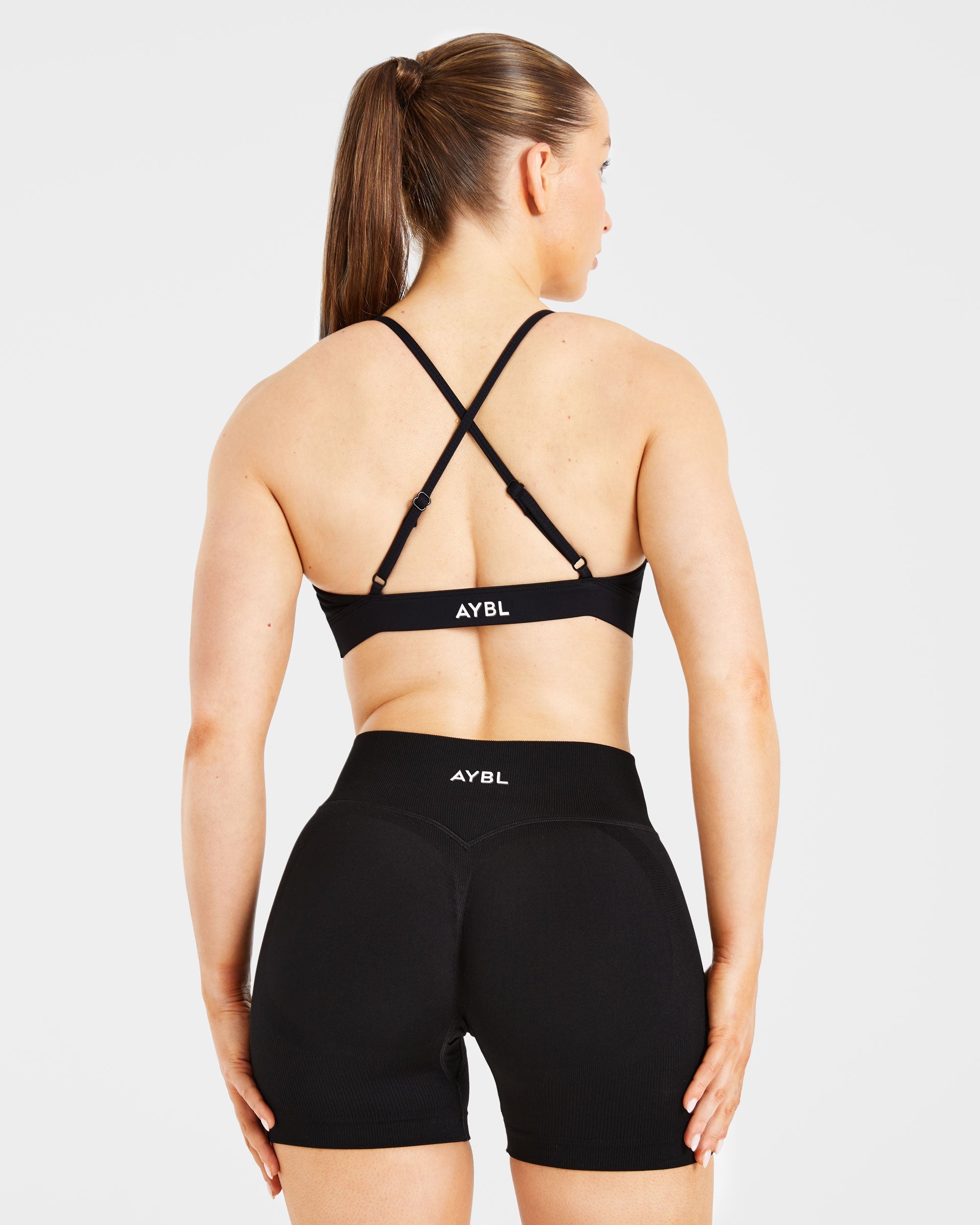 Essential Twist Crossback Sports Bra - Schwarz
