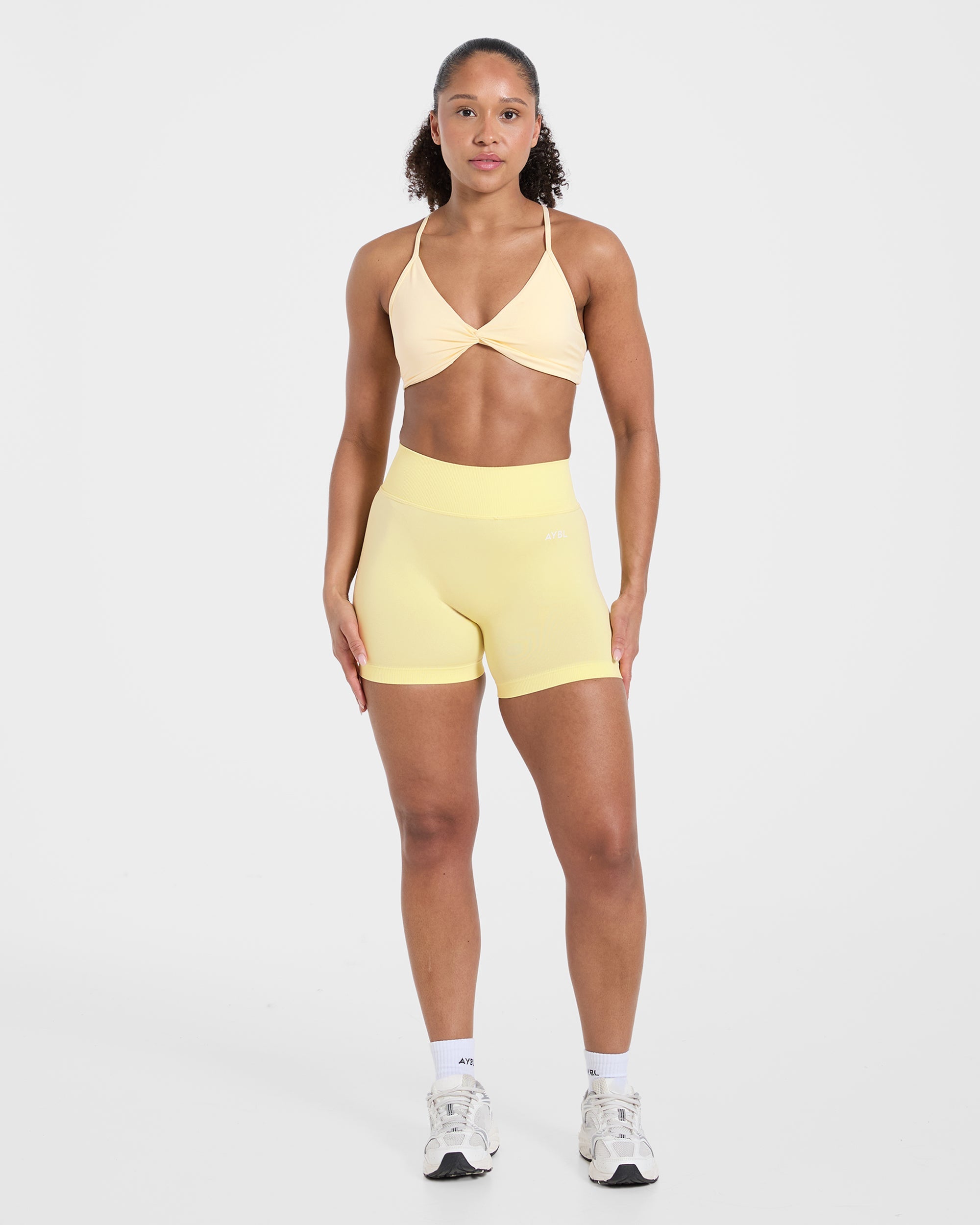 Essential Twist Crossback Sports Bra - Gelb