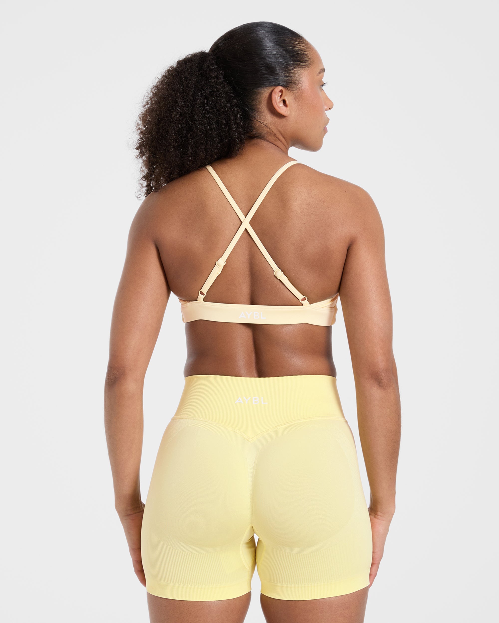 Essential Twist Crossback Sports Bra - Gelb