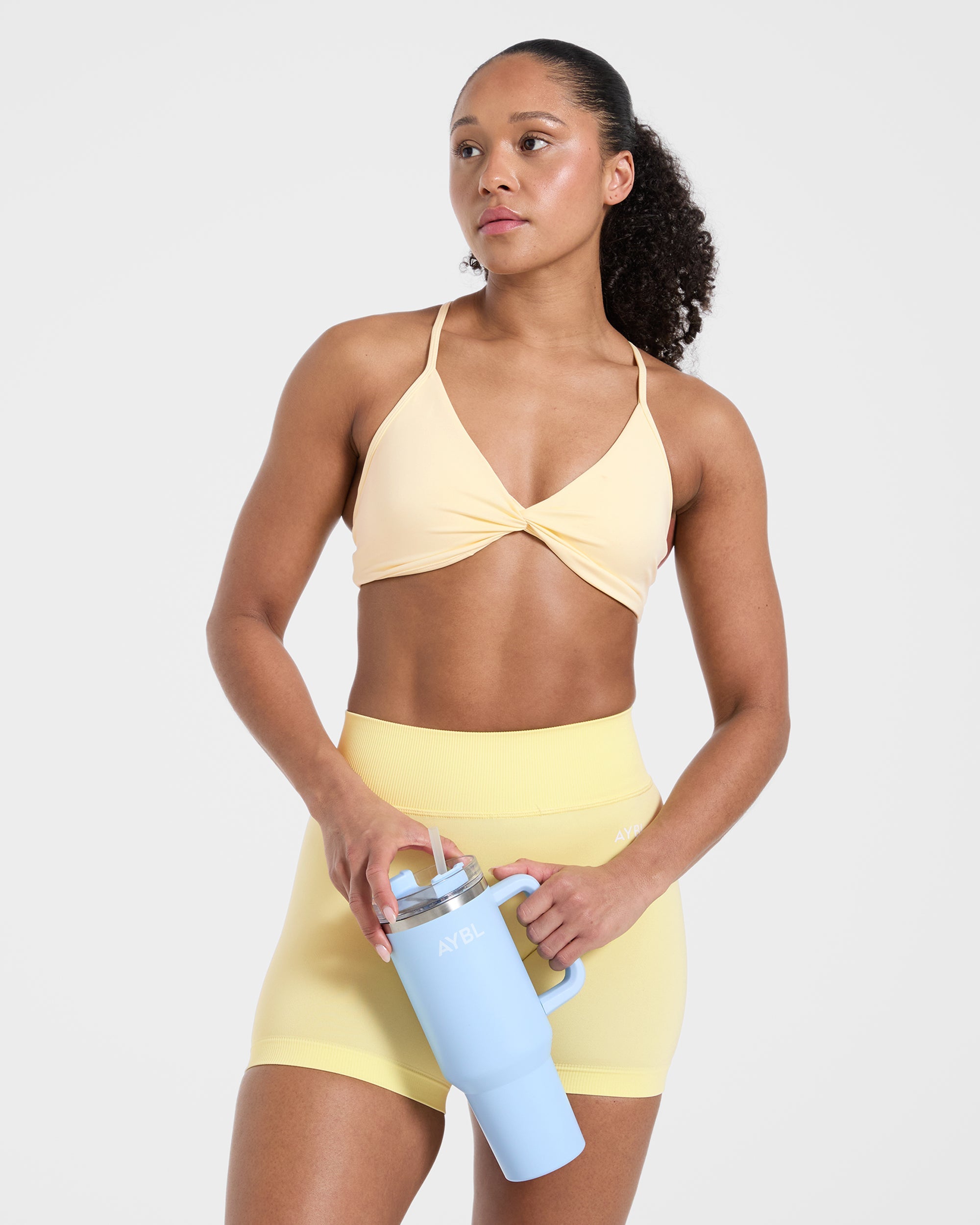 Essential Twist Crossback Sports Bra - Gelb