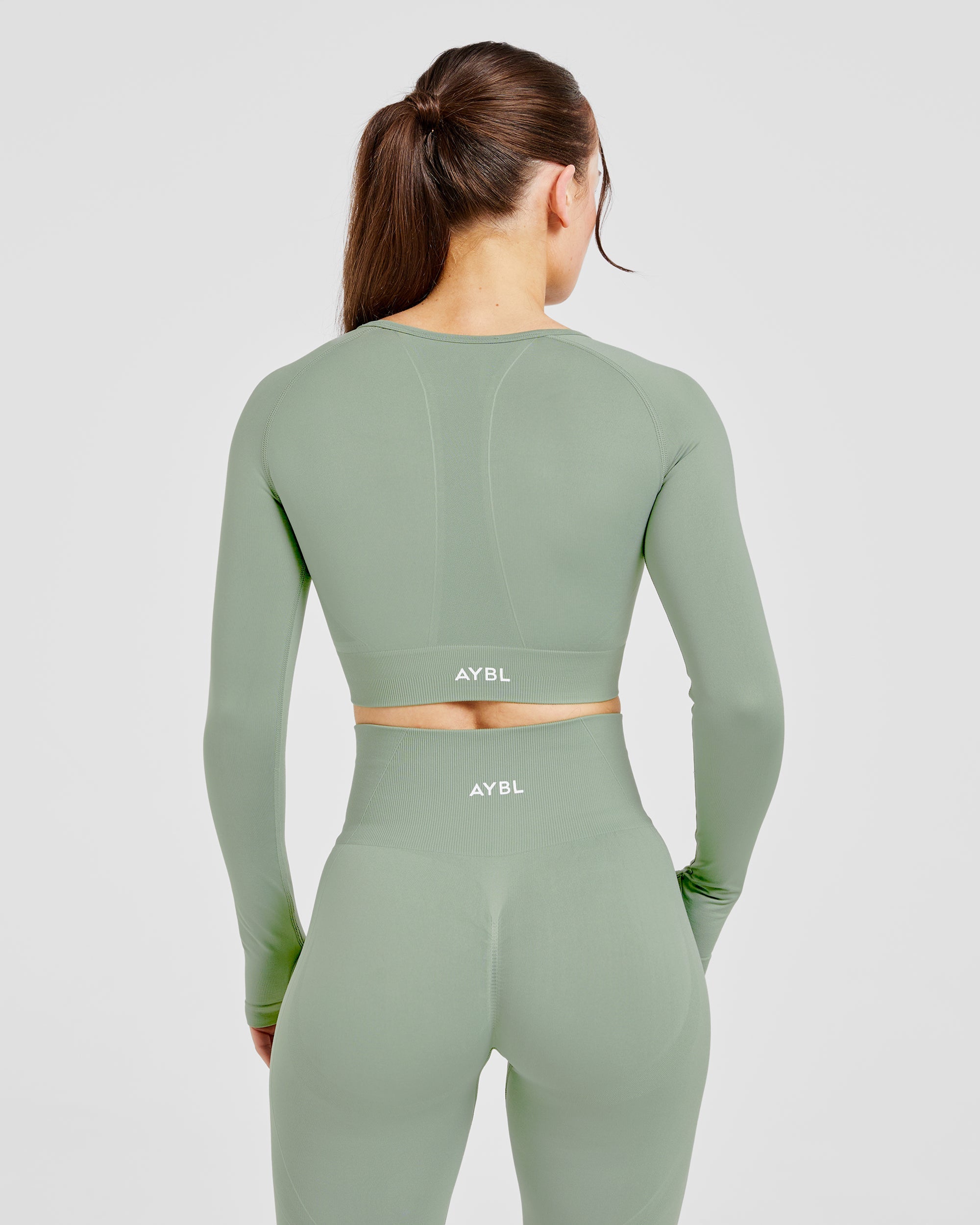 Empower Seamless Long Sleeve Crop Top - Grove Grün