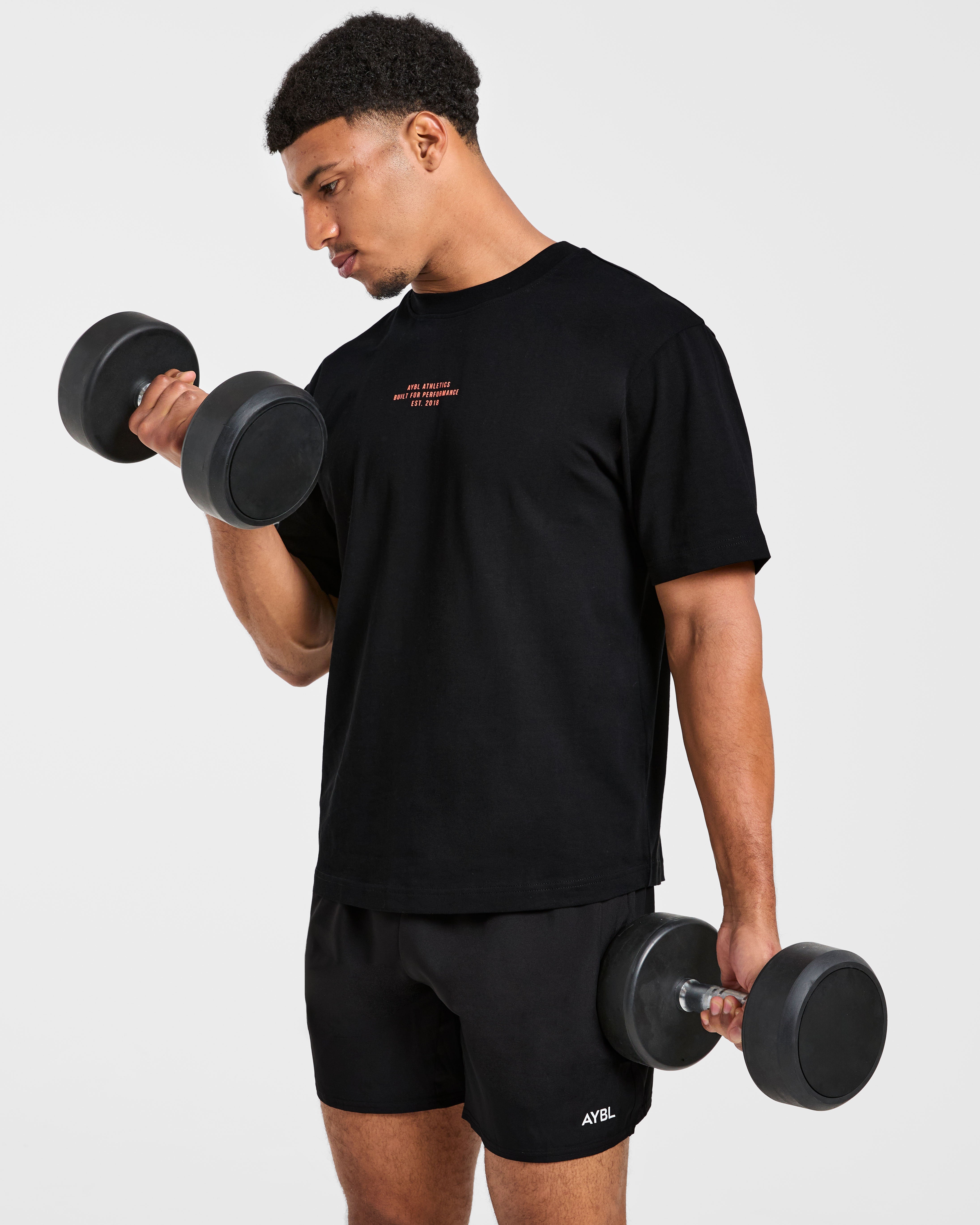 Athletics Performance T Shirt - Schwarz/Orange
