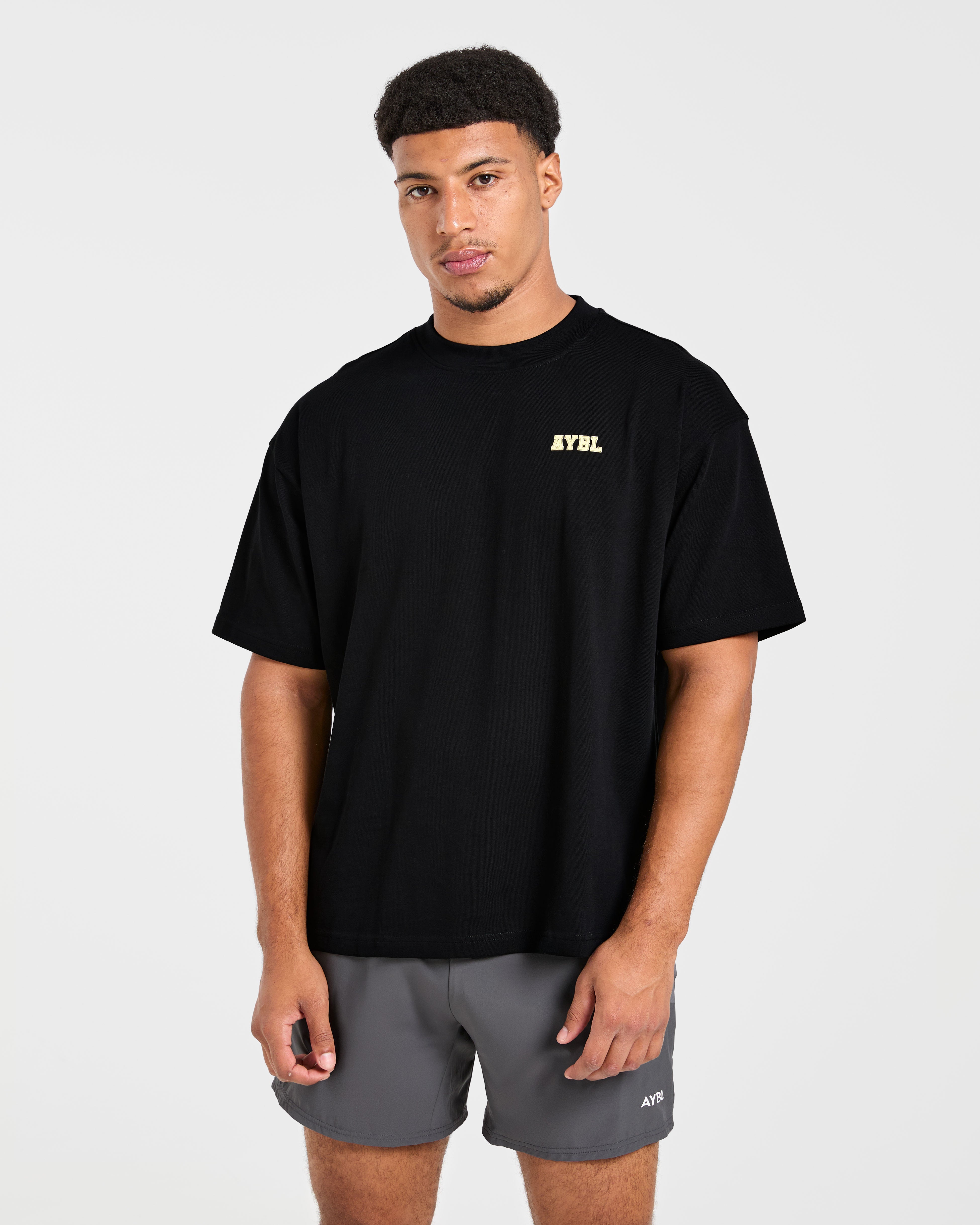 Power In Motion Oversized T Shirt - Schwarz/Gelb