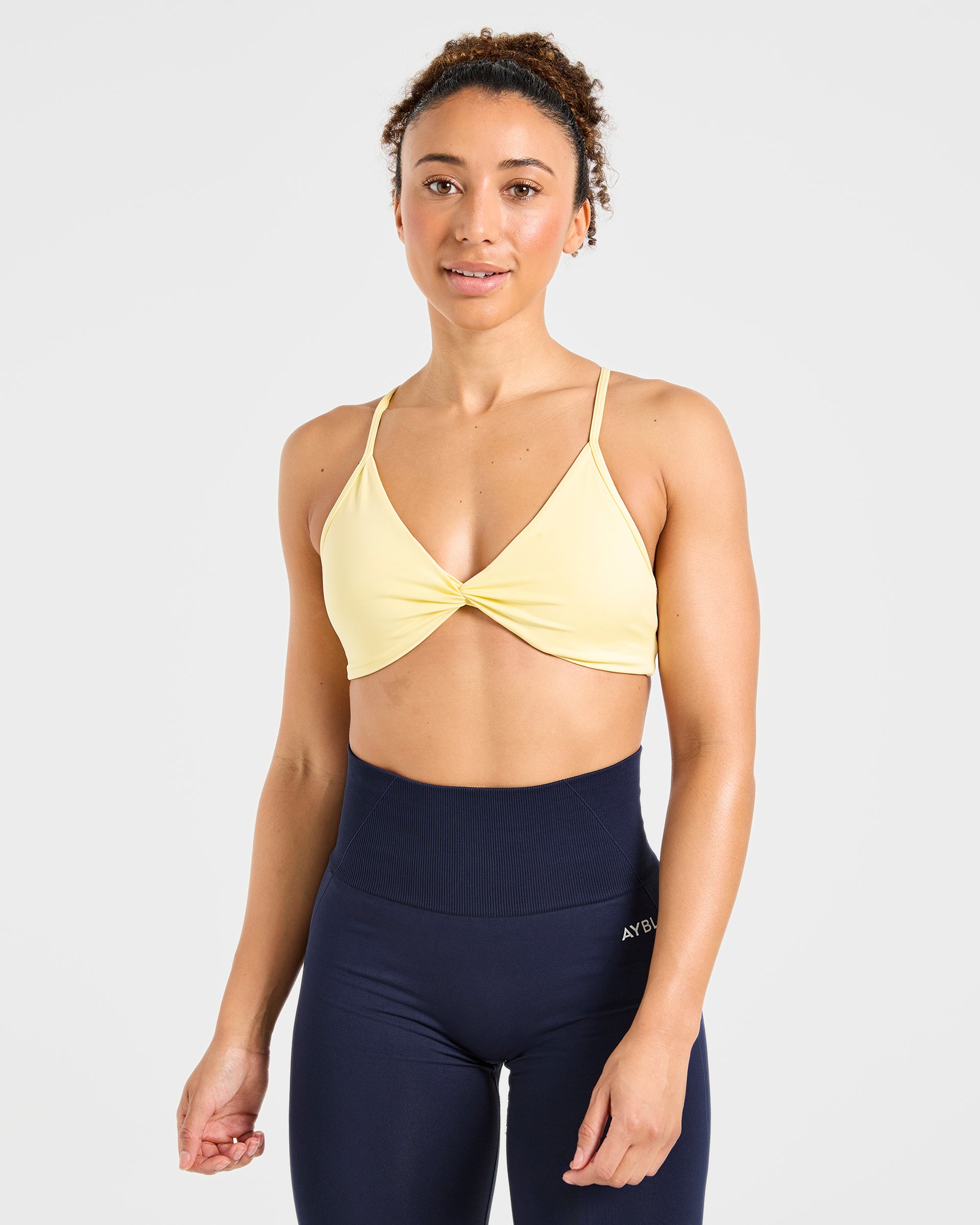 Essential Twist Crossback Sports Bra - Gelb