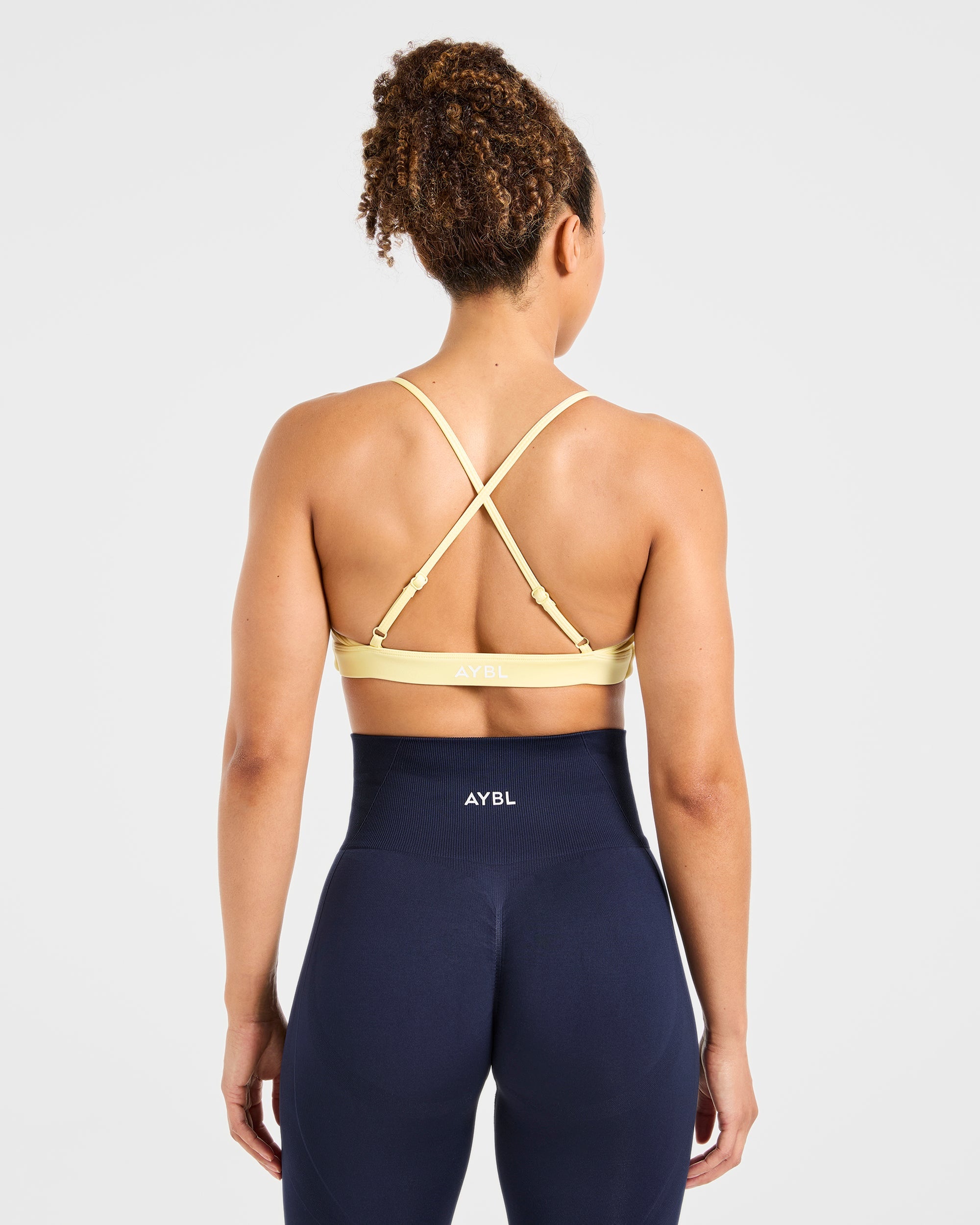 Essential Twist Crossback Sports Bra - Gelb