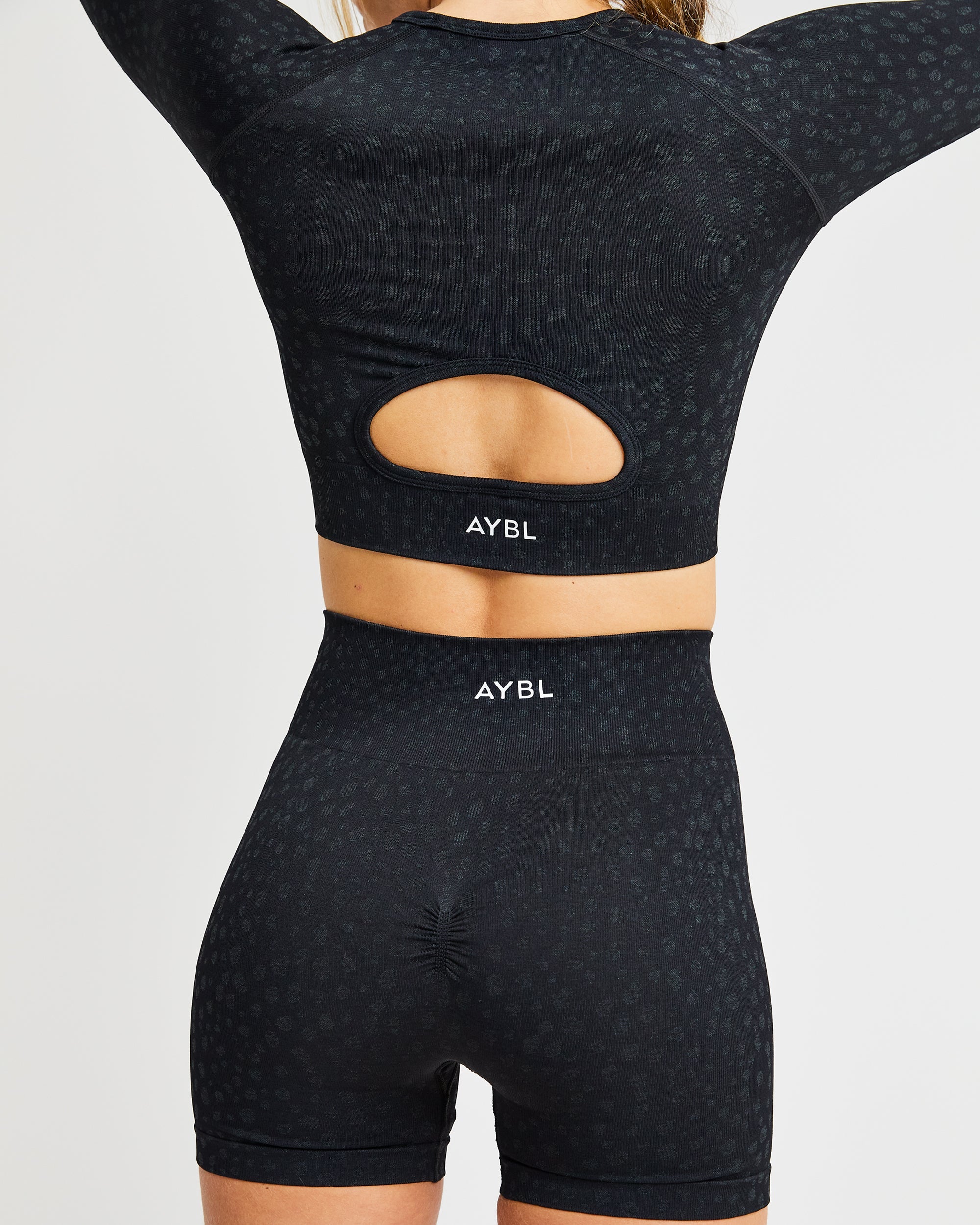 Evolve Speckle Seamless Long Sleeve Crop Top - Schwarz